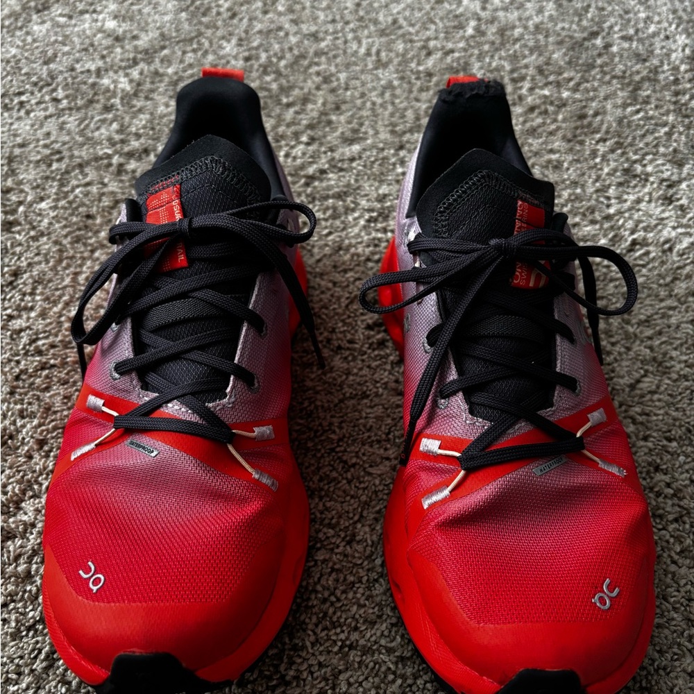 On Running Red and Black Sneakers